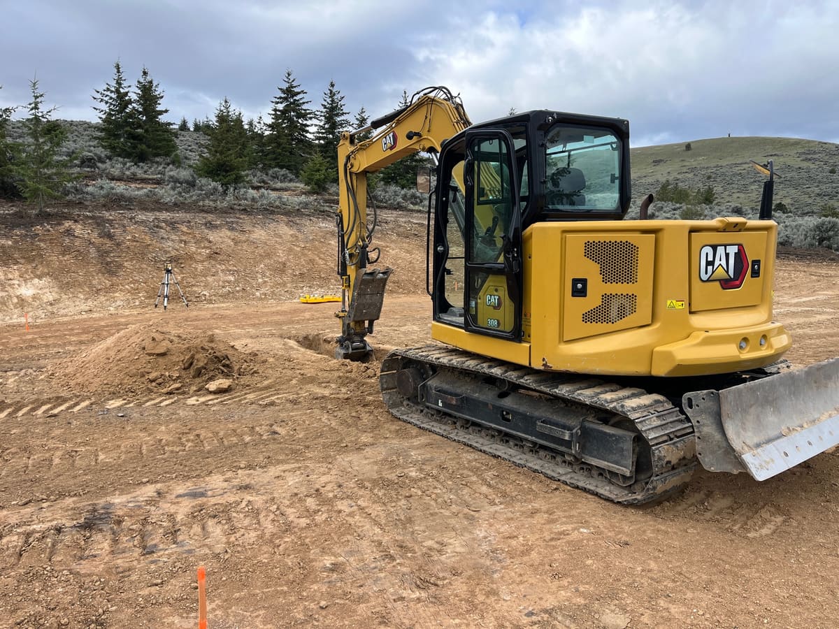 4M Land Improvement excavator cutting a building pad